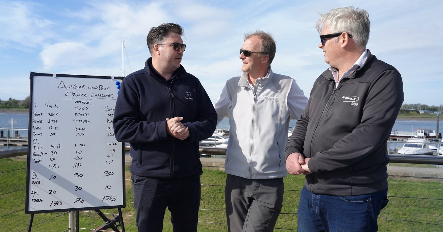 Jack Haines, Hugo Andreae and James Barke discussing the final Prop Gear scores at Essex Marina, with the scoreboard showing Jack and Hugo tied on 170 points in YachtBuyer's £300,000 used boat challenge.