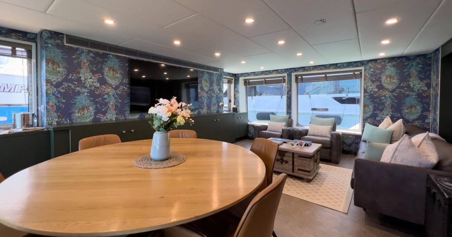 Bad Company Support main saloon with sofas and dining area