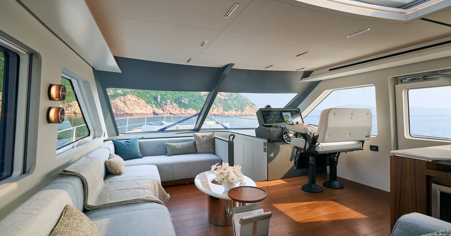 CL Yachts CLB65 SUV Motor Yacht helm station with L-shaped sofa