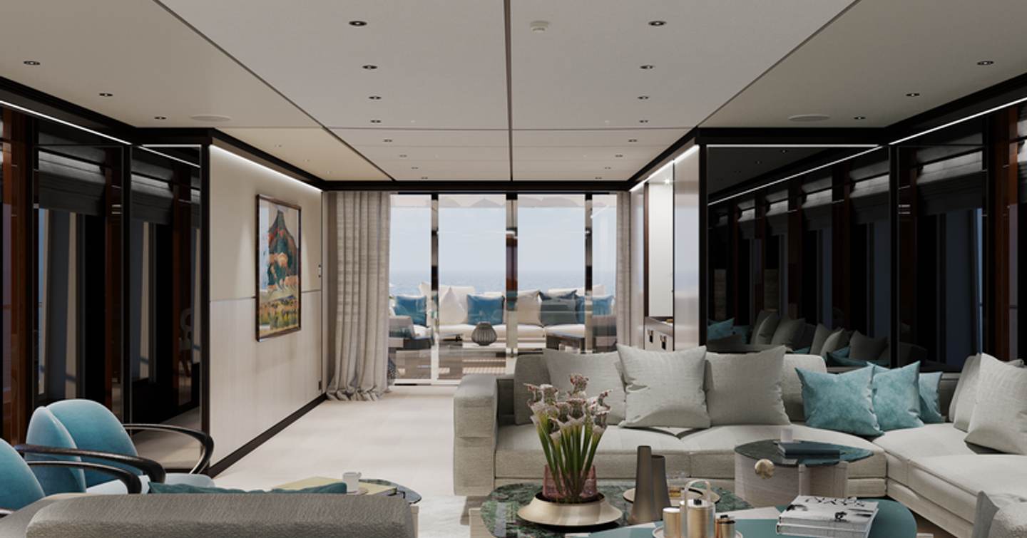 Main salon onboard Project Venus. L shape sofa to starboard, with exterior lounge area visible in the background.