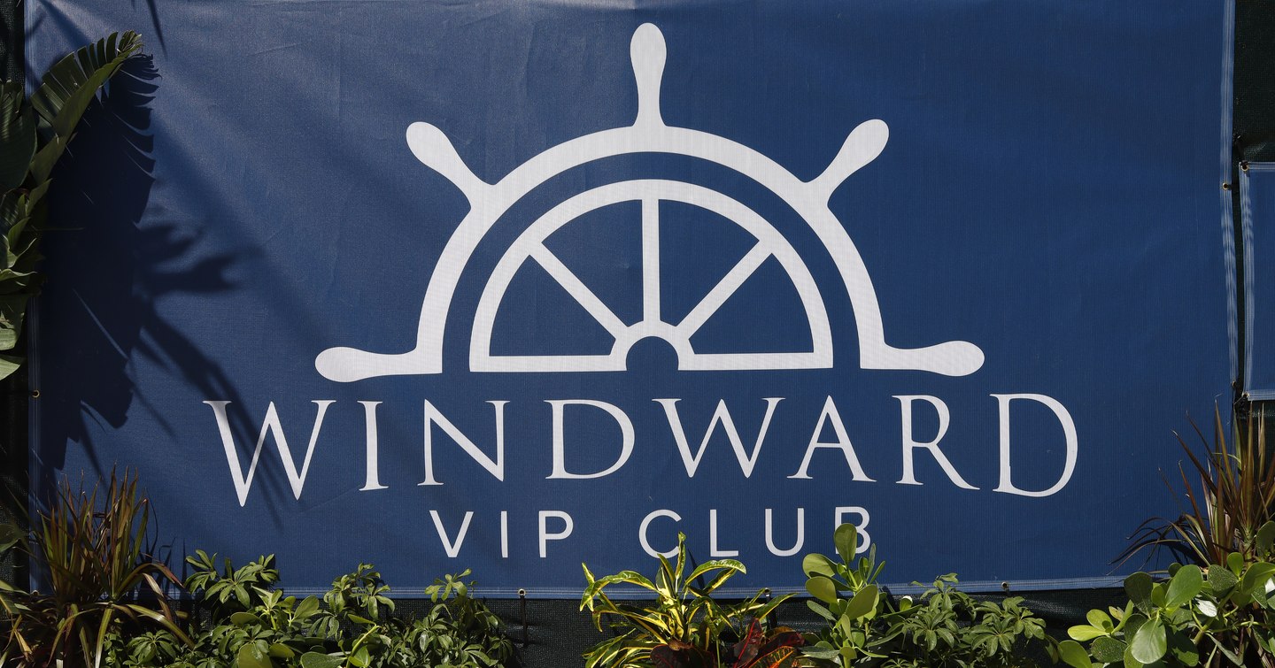 Windward VIP sign at Palm Beach International Boat Show. Surrounded by foliage.