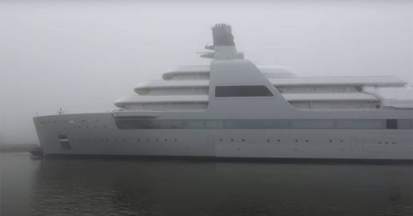 Side view of superyacht SOLARIS launch ceremony, shrouded in fog