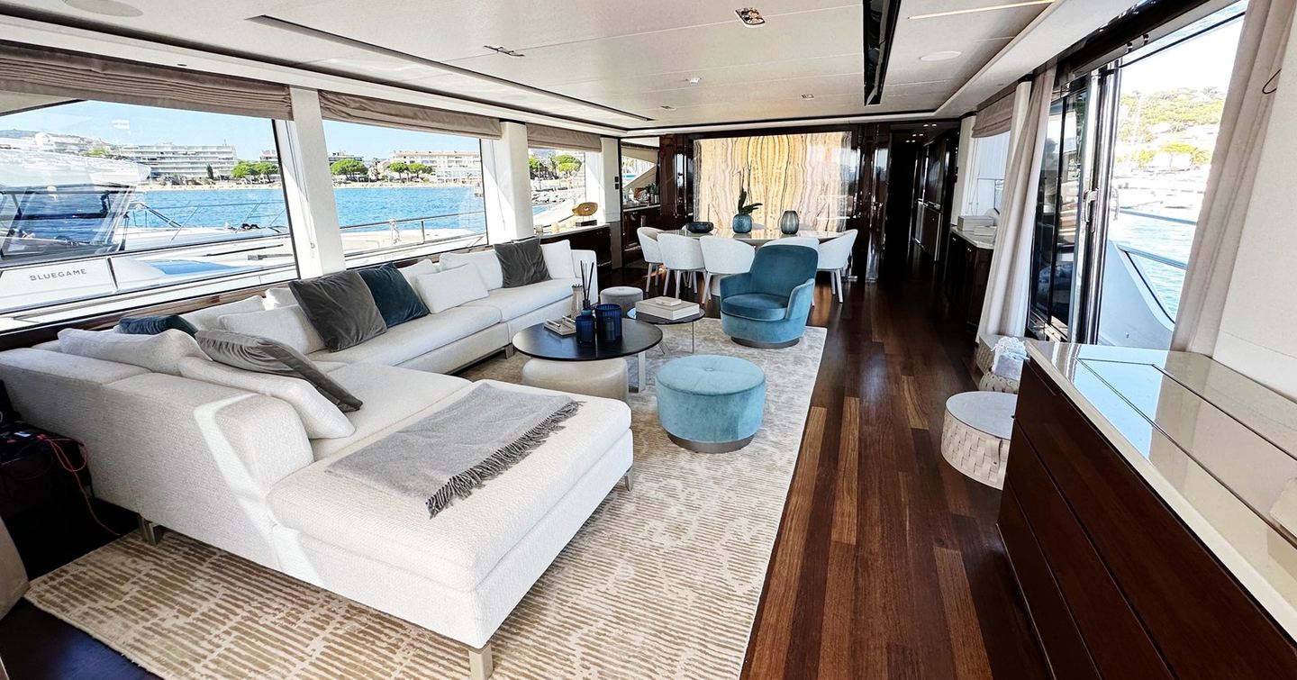 Motor yacht Ghost's main saloon with U-shaped sofa