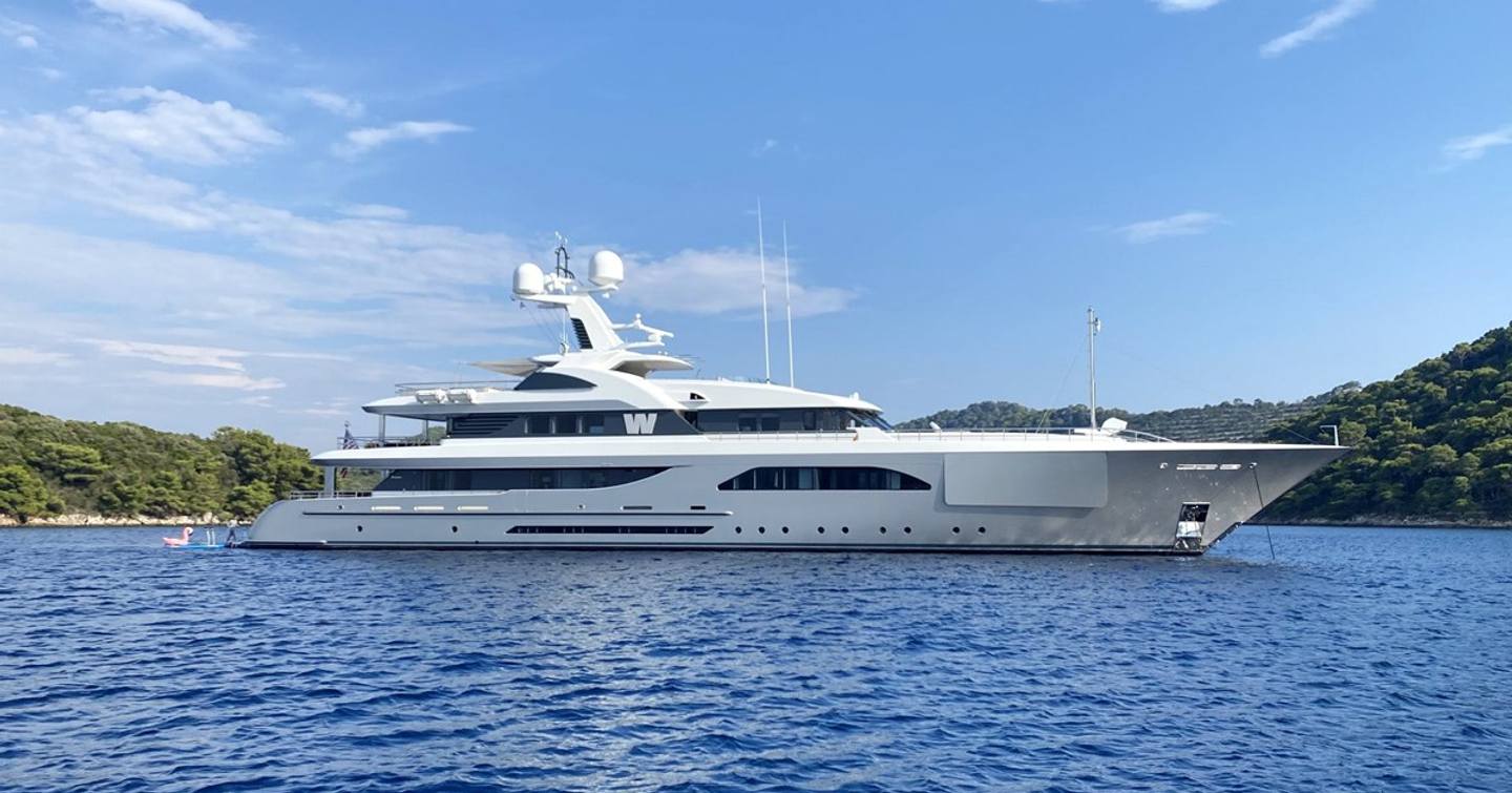 Motor yacht W at anchor on a fine day