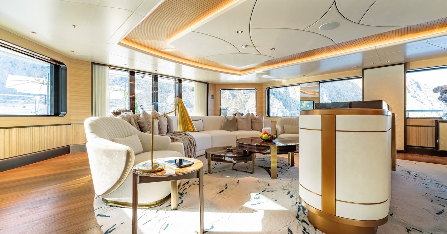 Damen Xplorer 60 expedition yacht main saloon with curved white seating 