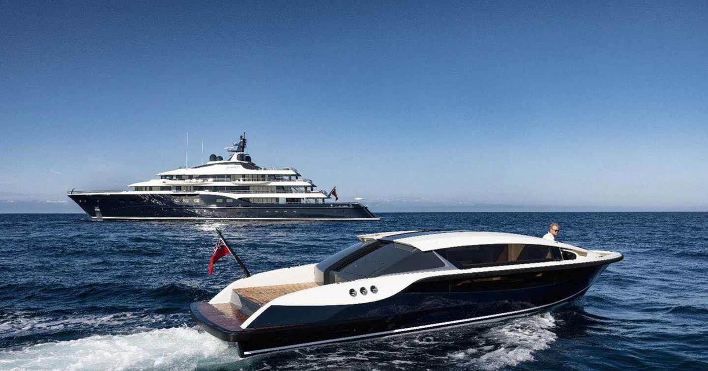 Superyacht Here Comes The Sun with sleek tender at sea