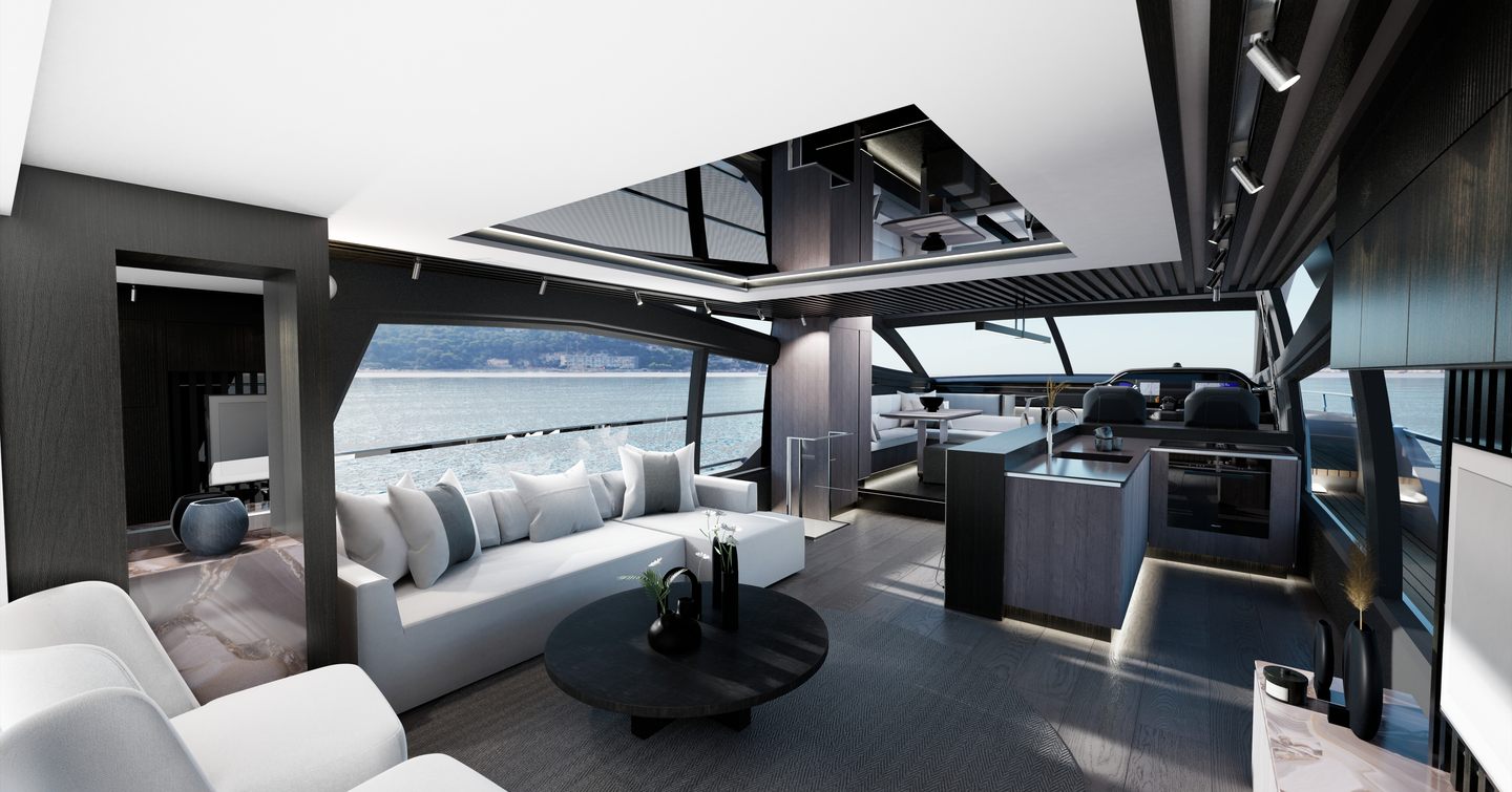 Overview of the main salon onboard the Pearl 72. White sofas face in to a black coffee table. Large windows surround with helm station visible in background.