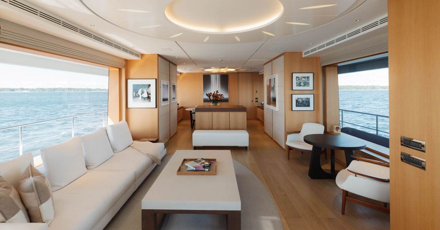 34m Feadship Superyacht Graycliffs main saloon with white furniture and circular ceiling light
