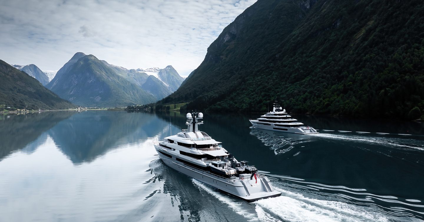 Aft shot of superyacht Leviathan and support yacht Draak under way 