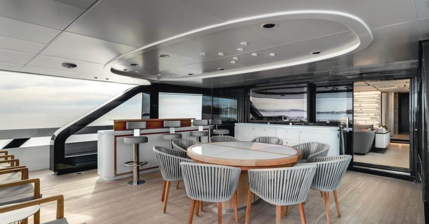Superyacht L.A.U.L. main aft deck with circular shaded alfresco dining