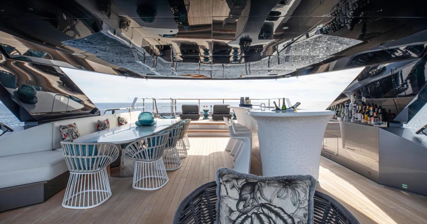 Motor Yacht Pandion Pearl's lower deck with bar and lounging area