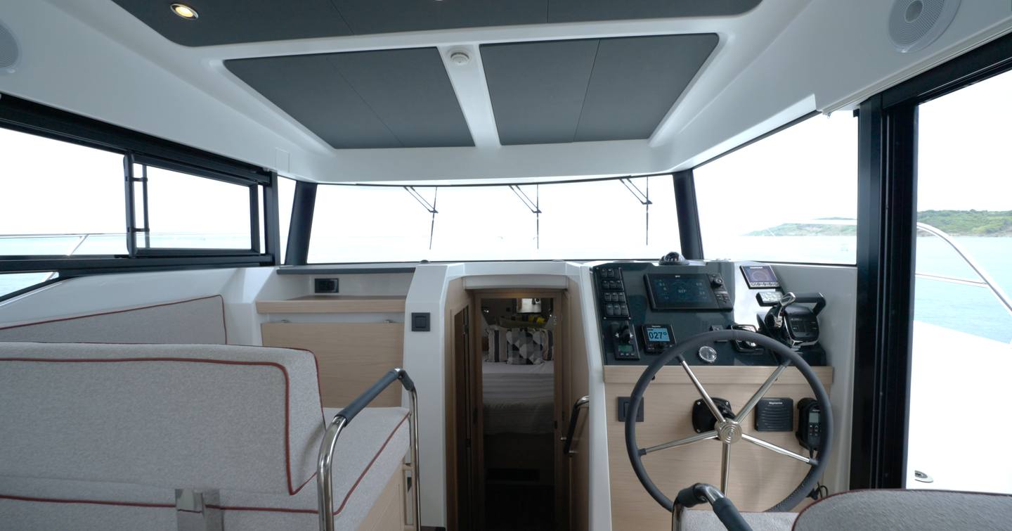 Lower helm station with companion seating on the Beneteau Swift Trawler 37 Fly