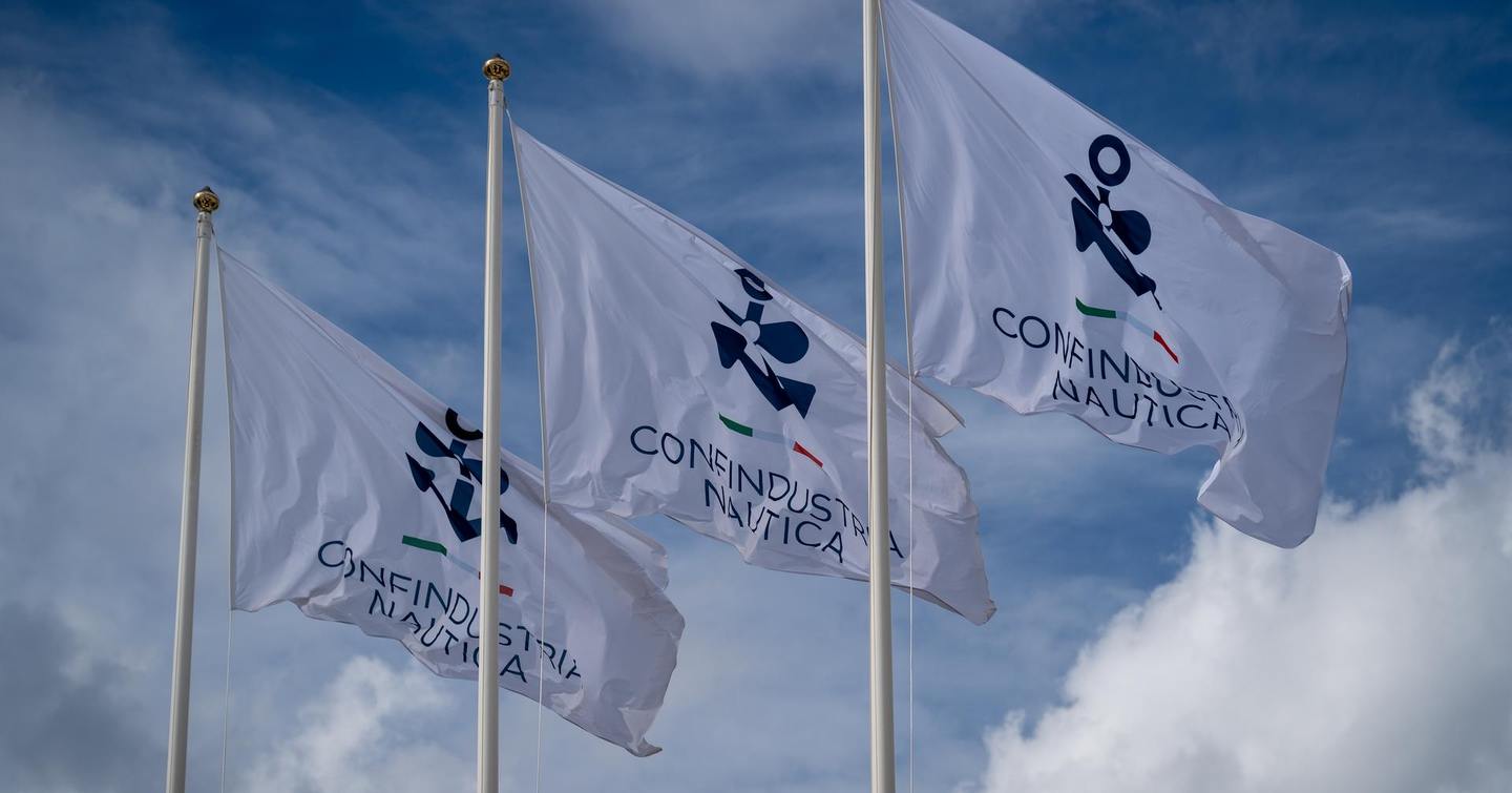 Three white flags with the Confindustria Nautica logo