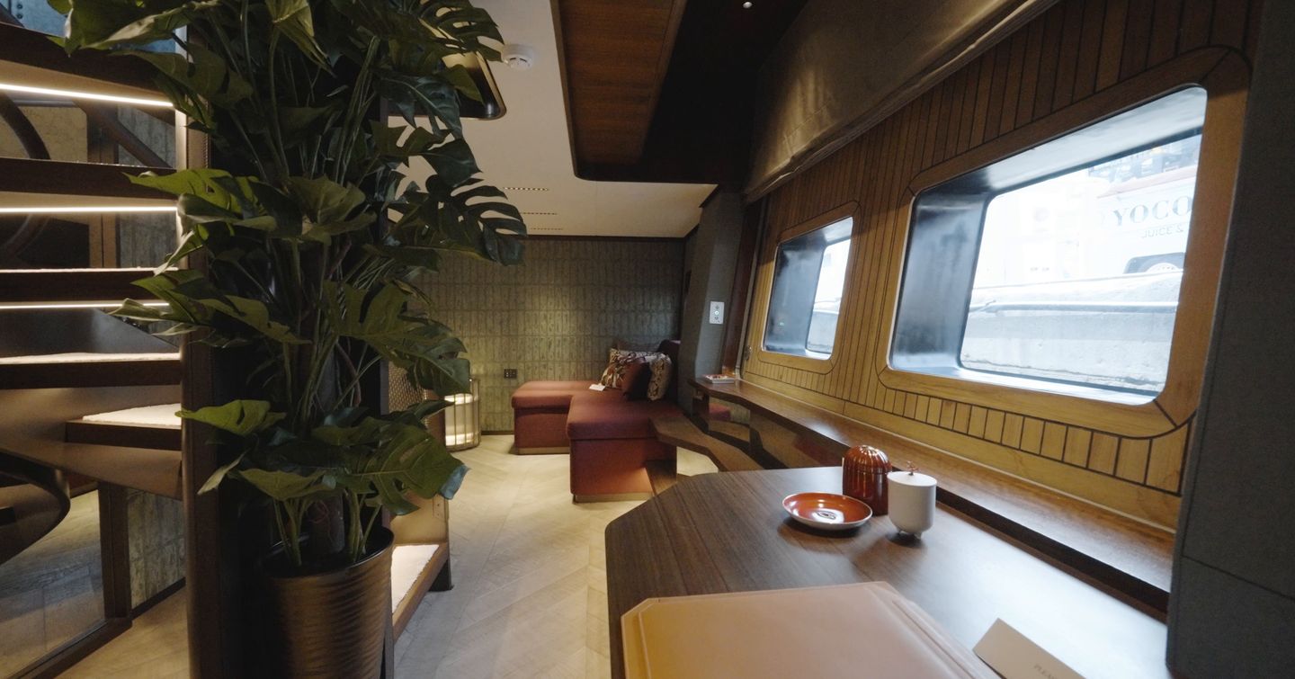 Sirena 118 lower owner’s lounge and study with desk and sofa