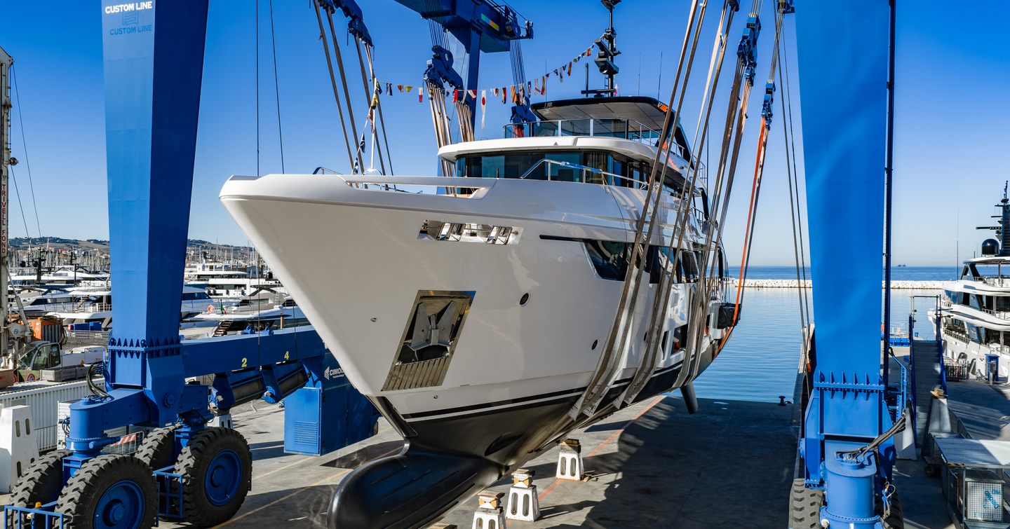 Fifth Custom Line Navetta 38 motor yacht at launch ceremony lowered 