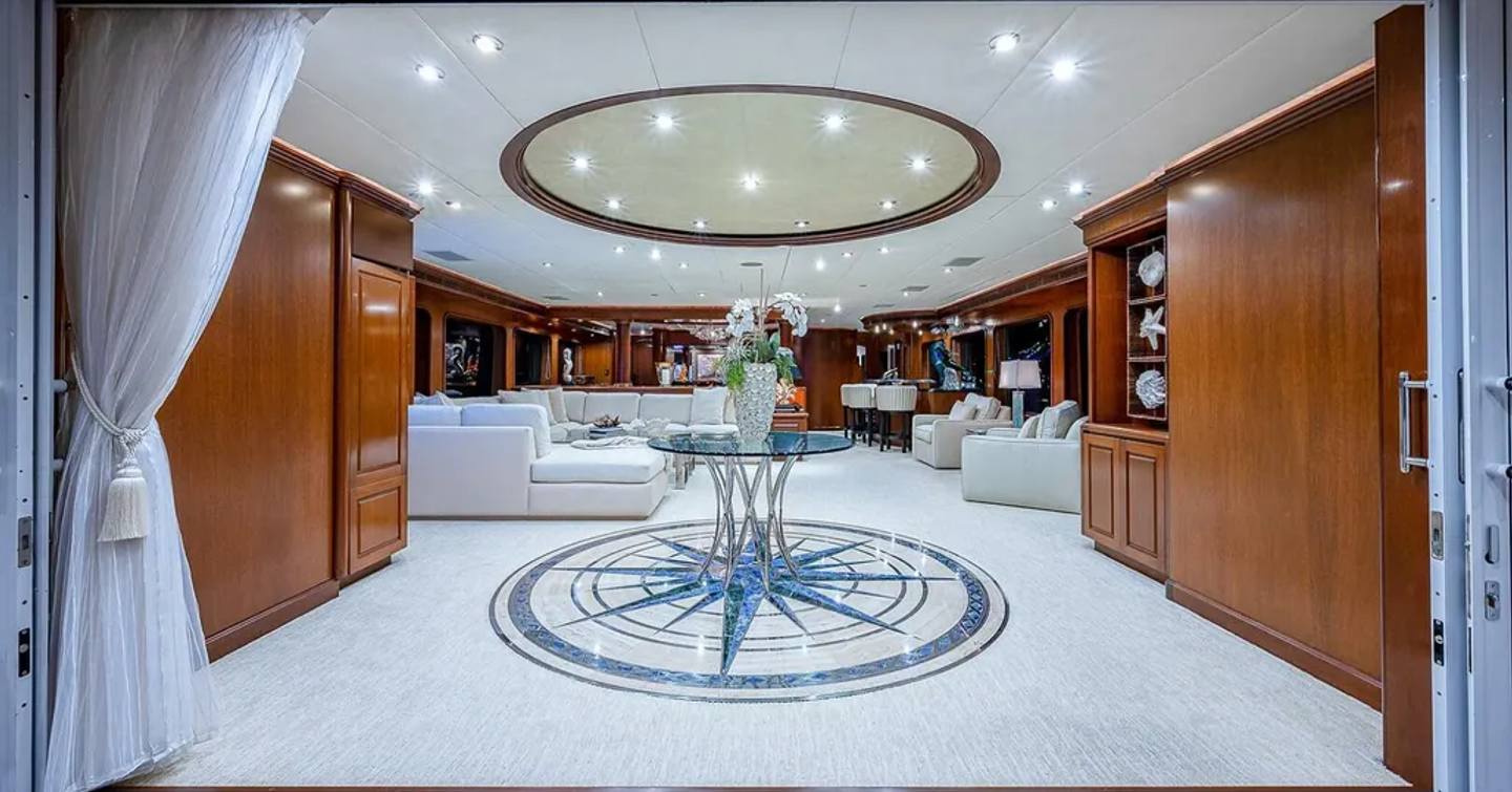 Superyacht La Sirena's main saloon with star detailing and L-shaped sofa