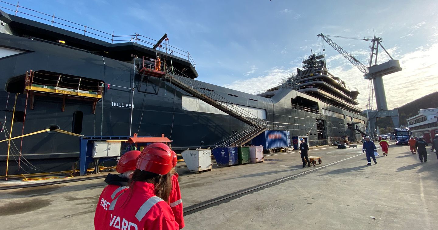 Press team walking next to REV Ocean during construction