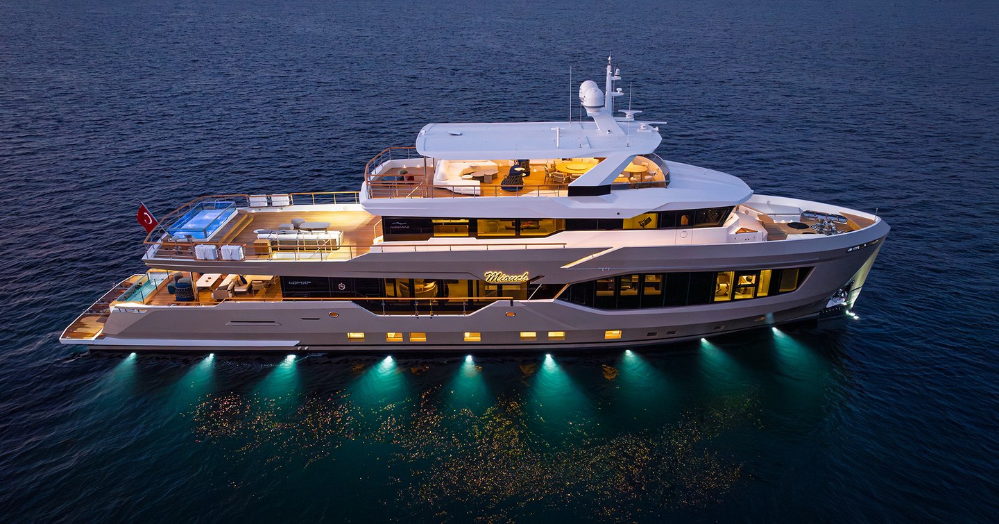 Numarine 40MXP Superyacht at night with underwater hull lights
