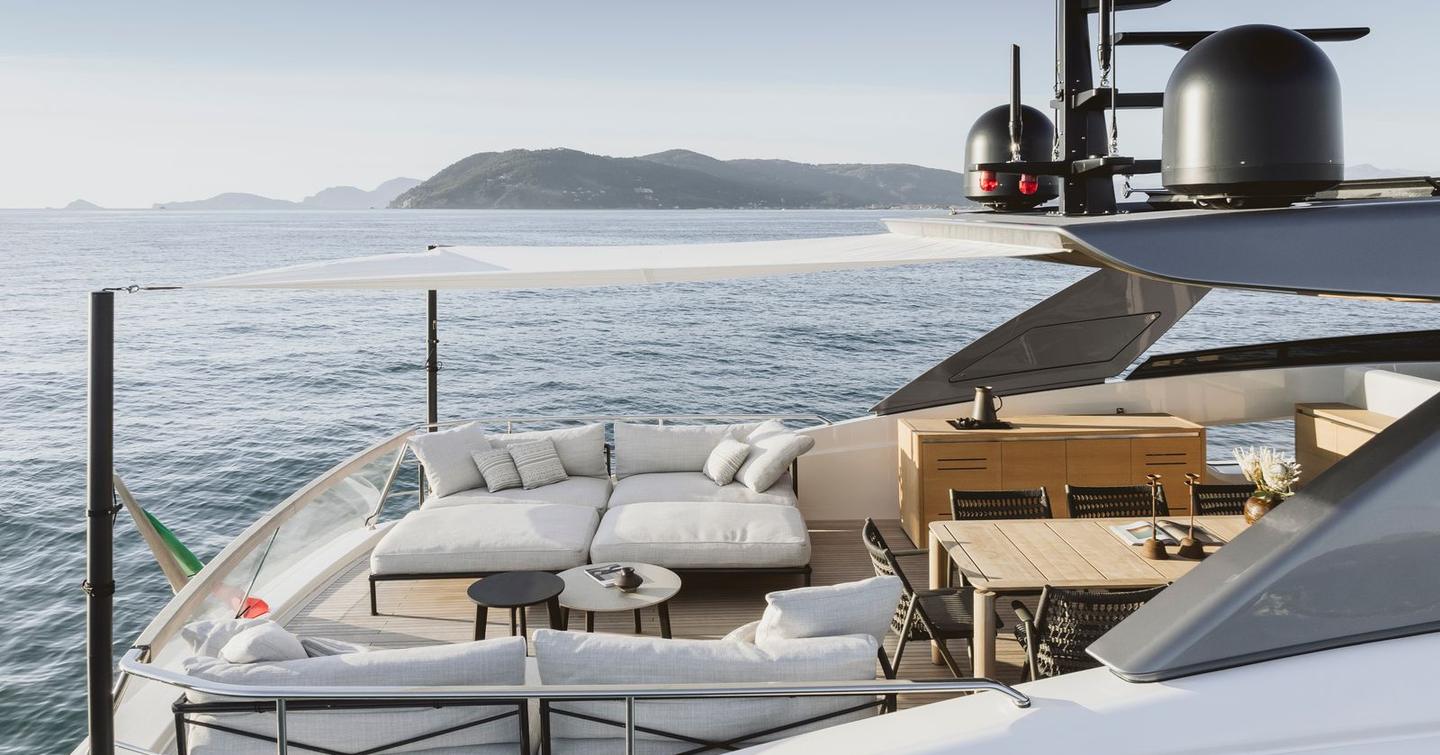 Sanlorenzo SL86A motor yacht flybridge with alfresco dining and white sunpads