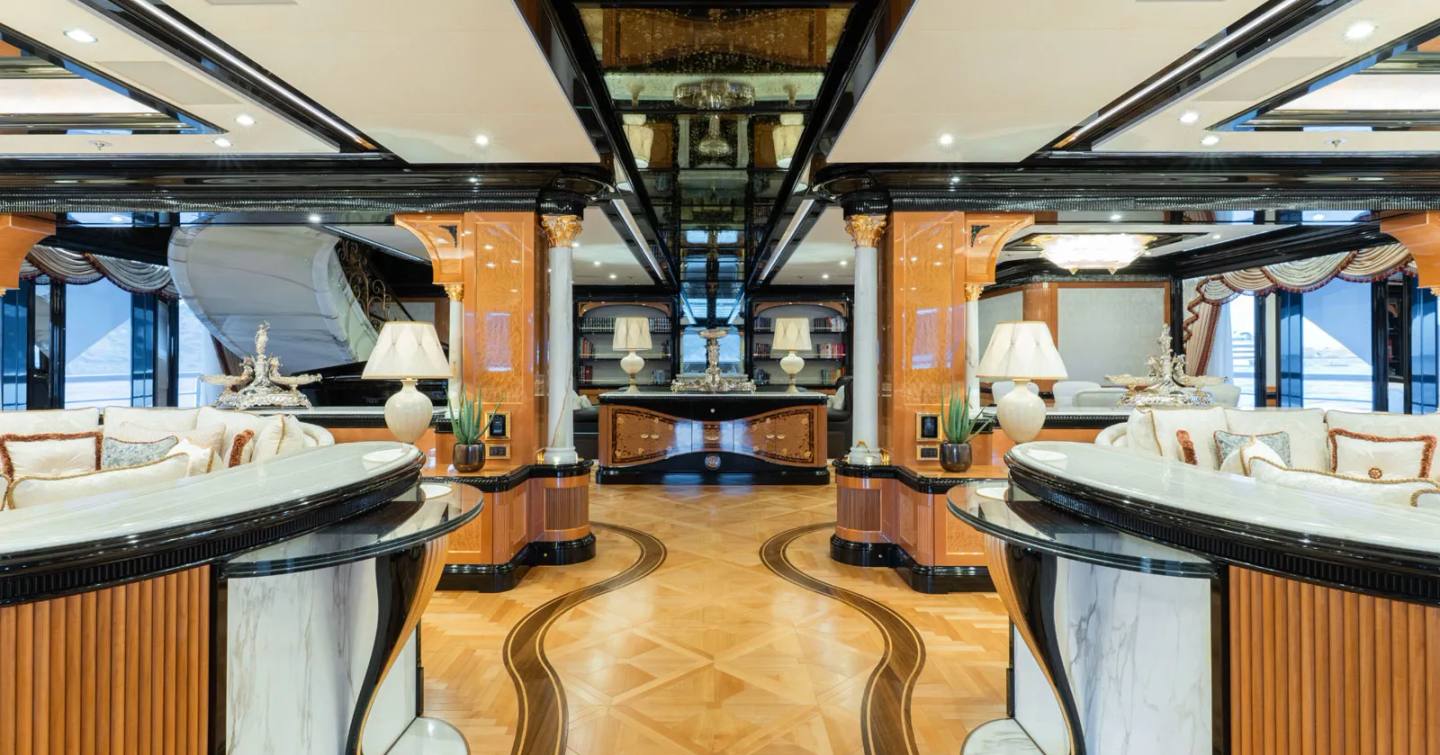 Superyacht I Dynasty main saloon with dual seating areas and marble flooring