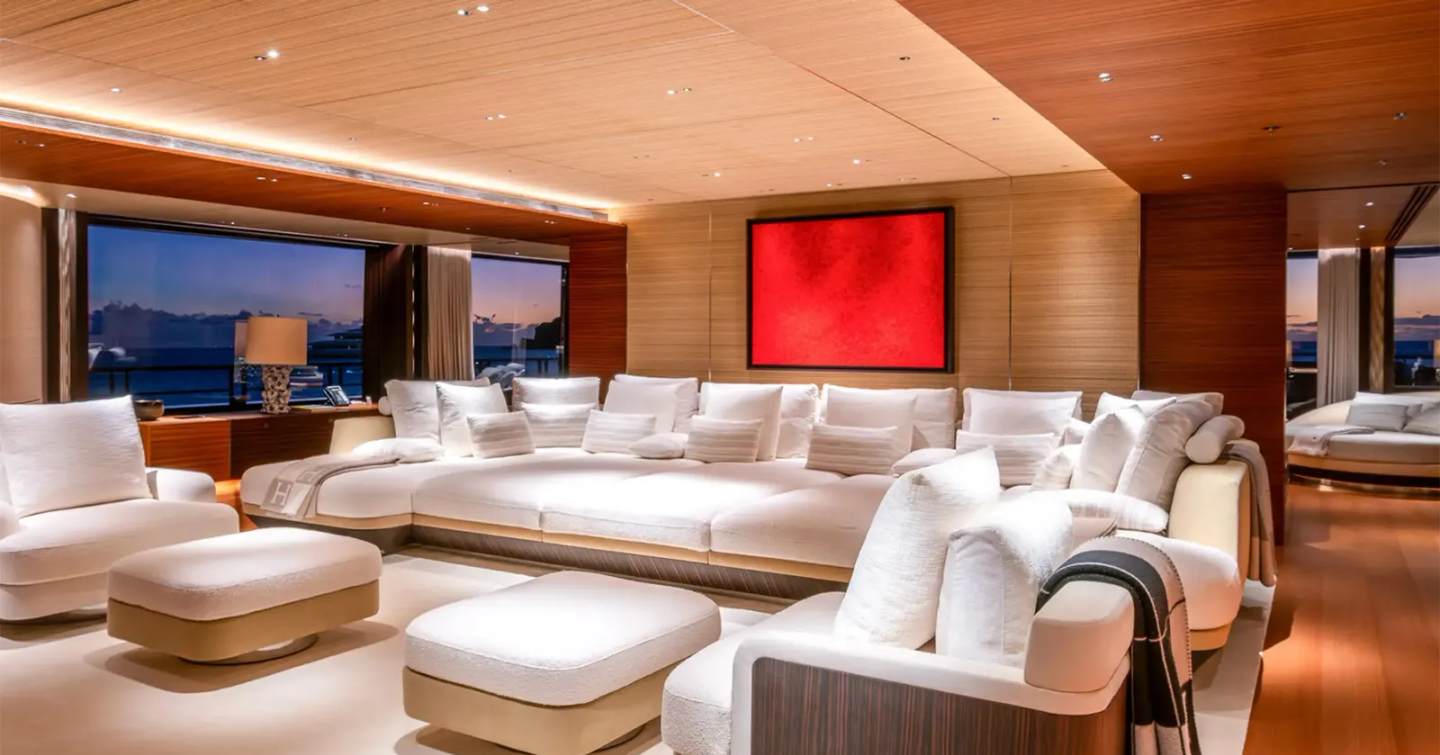 Superyacht Moonrise saloon area with white sofa sofas and red paintings 