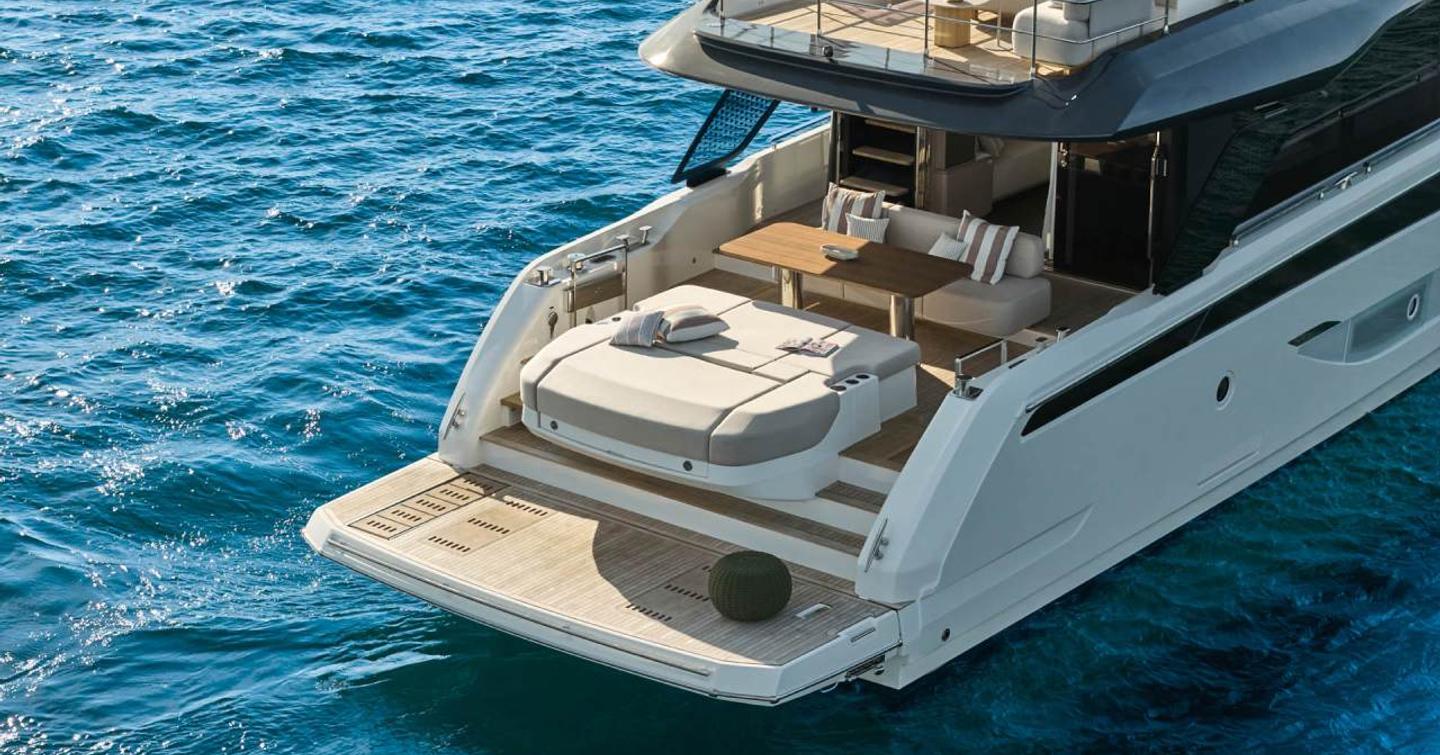 Prestige F6.7 yacht at anchor stern view 