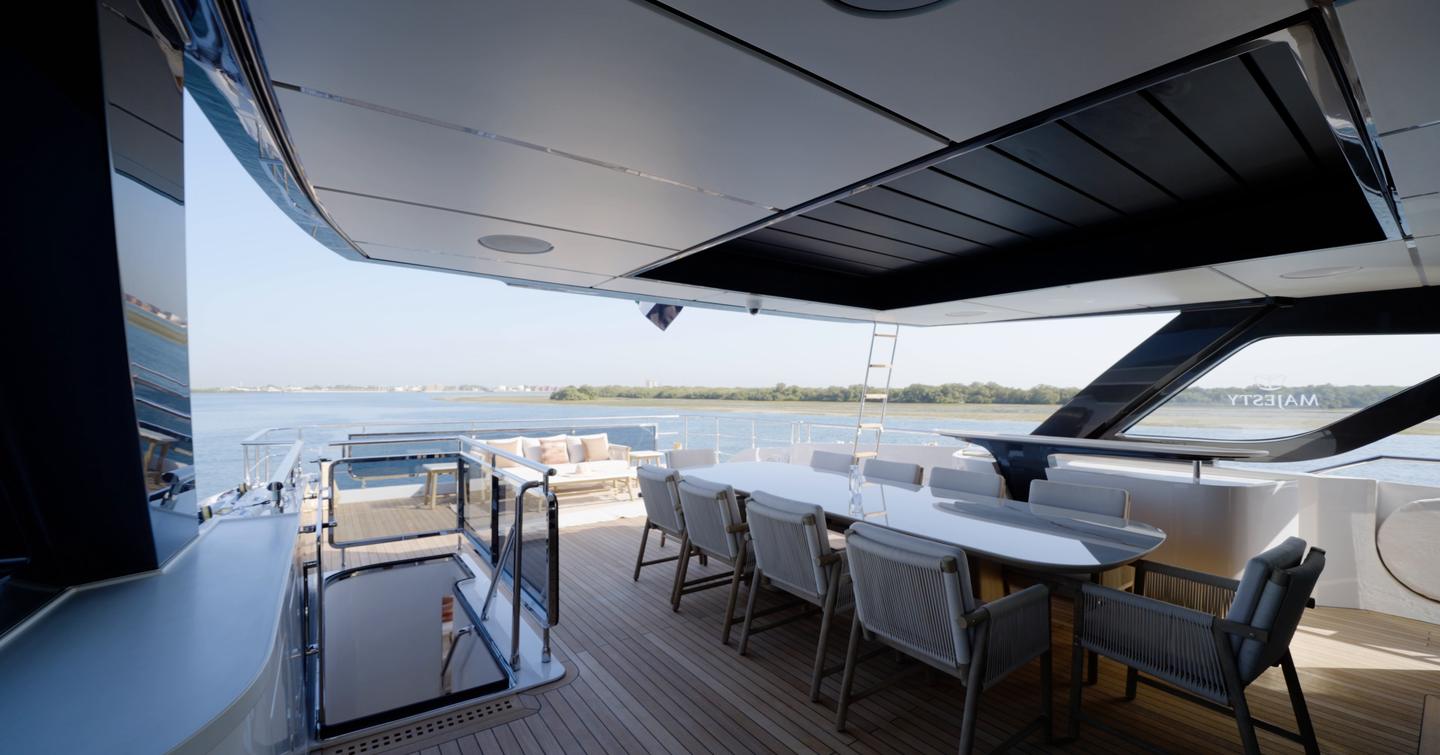 Bridge deck aft dining area aboard the Gulf Craft Majesty 100 Terrace with outdoor galley