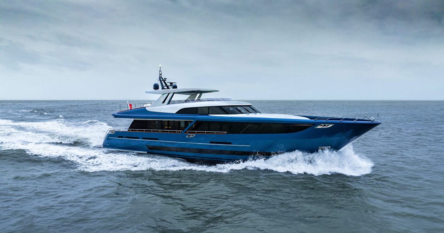 Side view of superyacht Blue Jeans underway, surrounded by sea