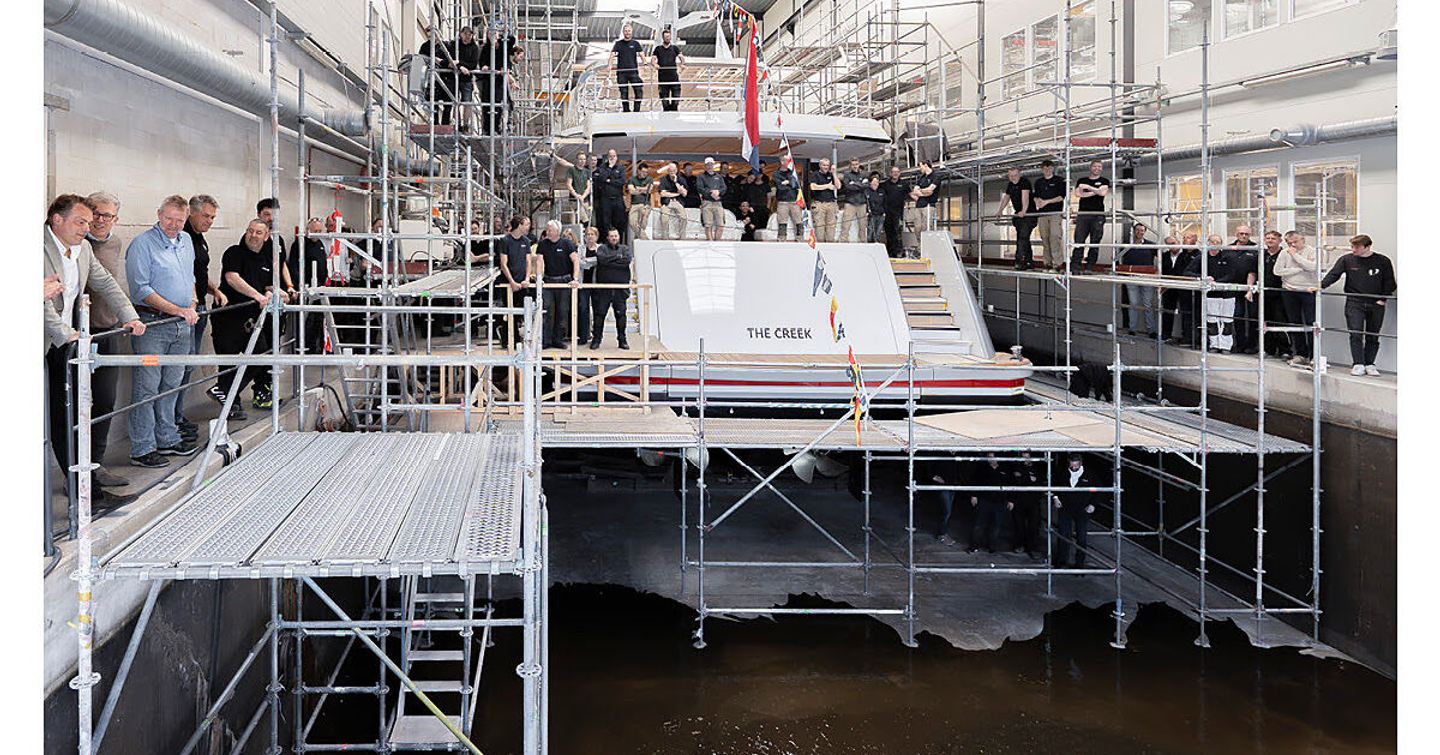 Ninth Mulder ThirtySix Superyacht stern with workers around at launch ceremony