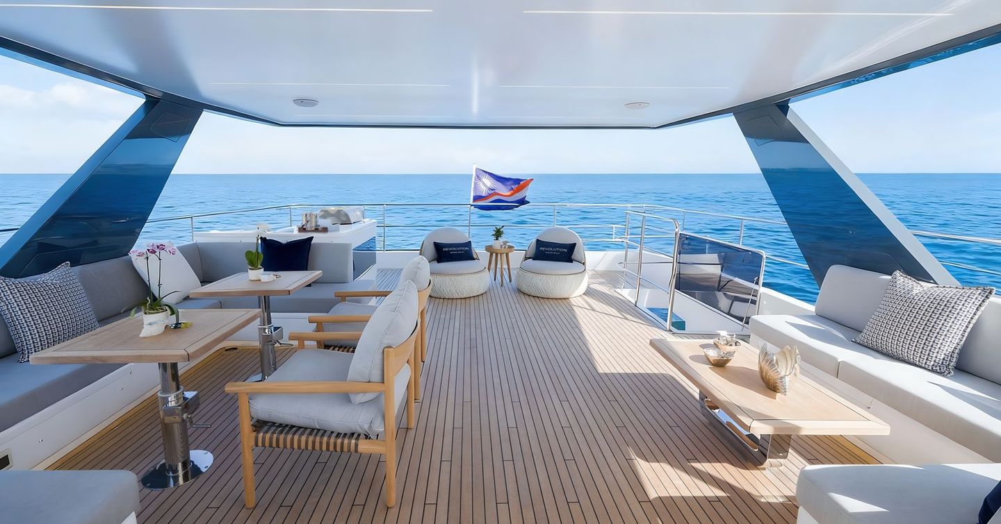 Oceanwalker S60 Catamaran flybridge with alfresco dining and shaded seating 