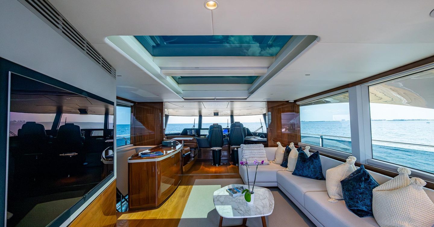 Motor Yacht Splash skylounge with mounted TV and helm station