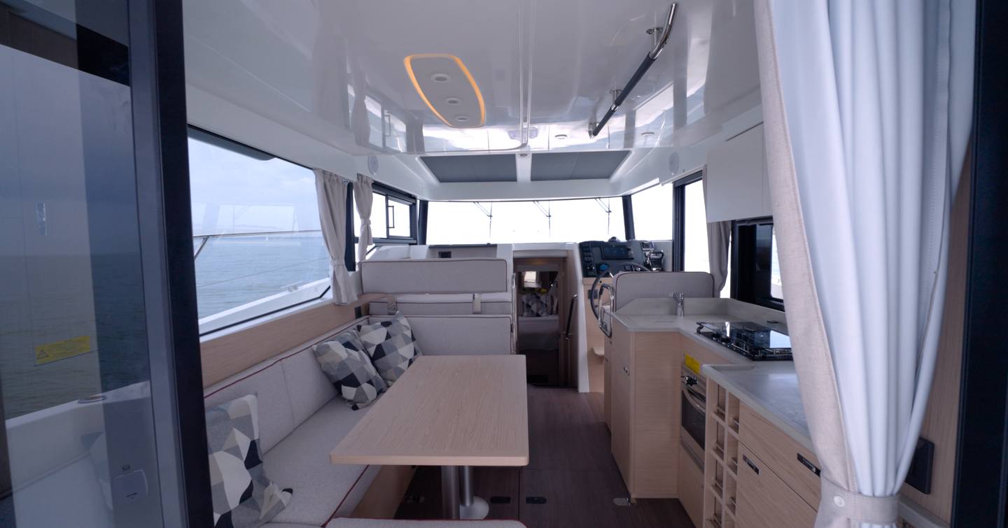 Beneteau Swift Trawler 37 Fly saloon with oak interior and U-shaped galley
