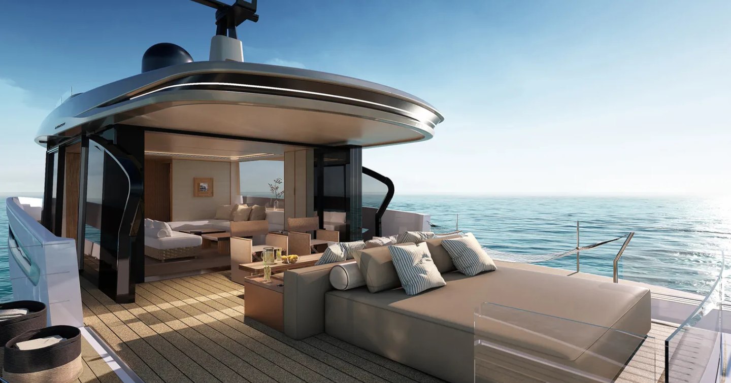 Aft view rendering of Seadeck 7, exterior deck features central sun pad with interior lounge visible in background, surrounded by sea.