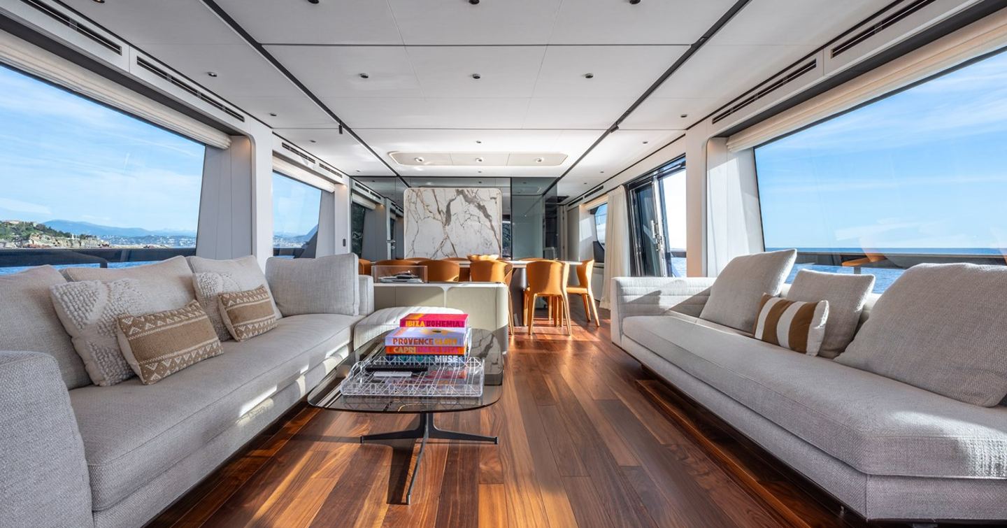 Motor Yacht Together main saloon wit white sofas and forward dining area