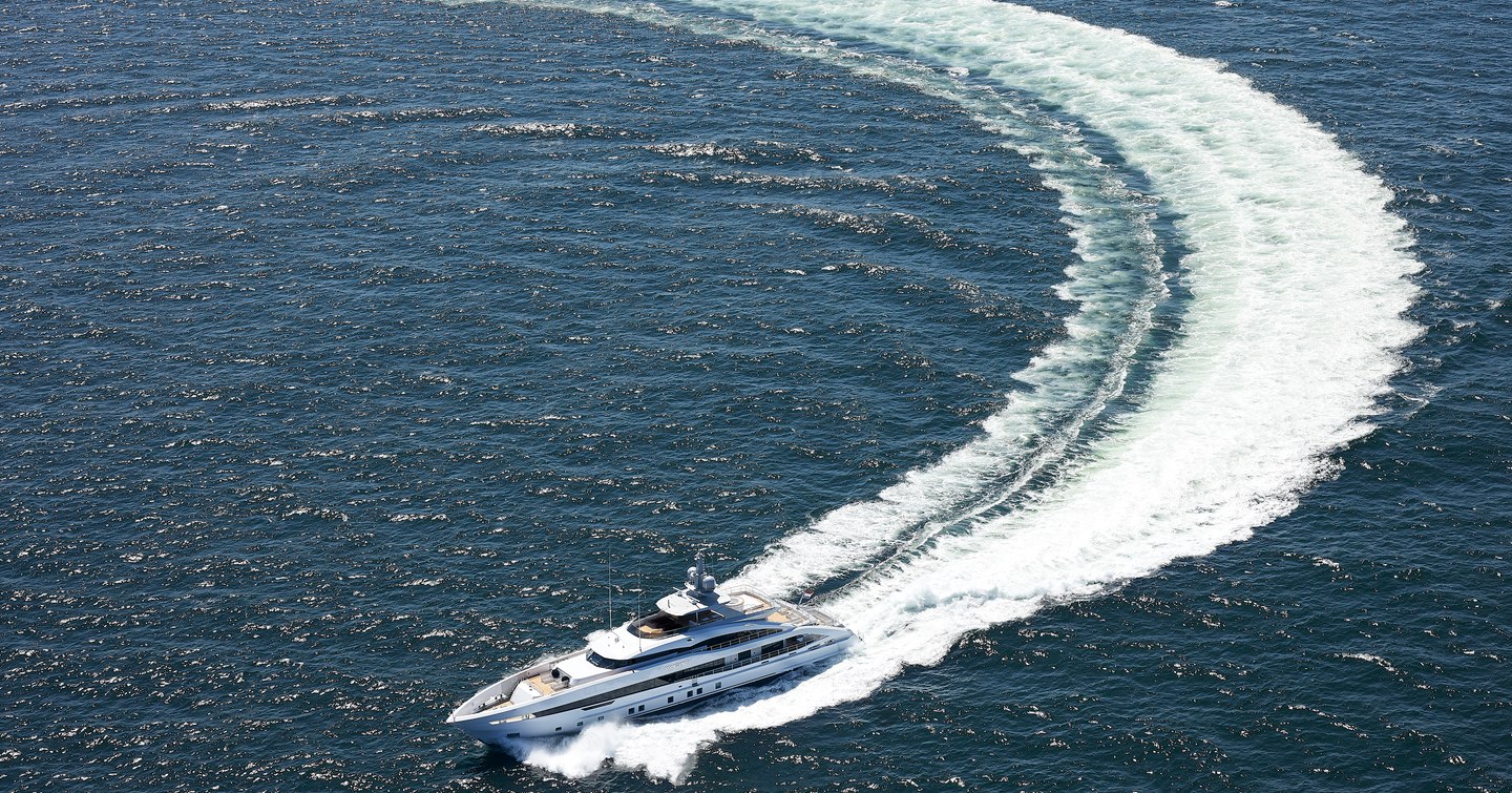 Aerial view of Heesen superyacht Book Ends underway, surrounded by sea.