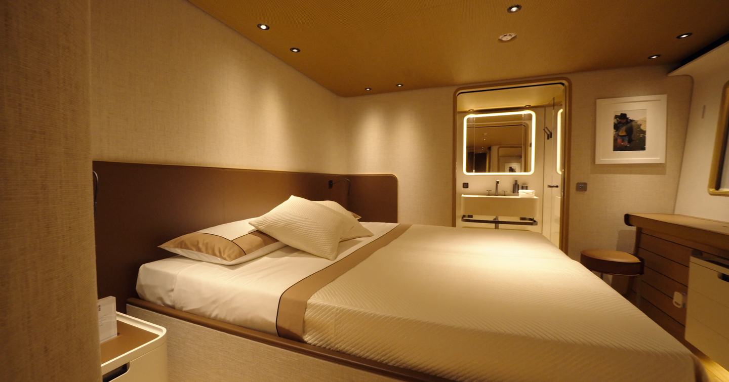 Custom Line Navetta 38 VIP cabin with double bed, extra space around bed and ensuite bathroom forward