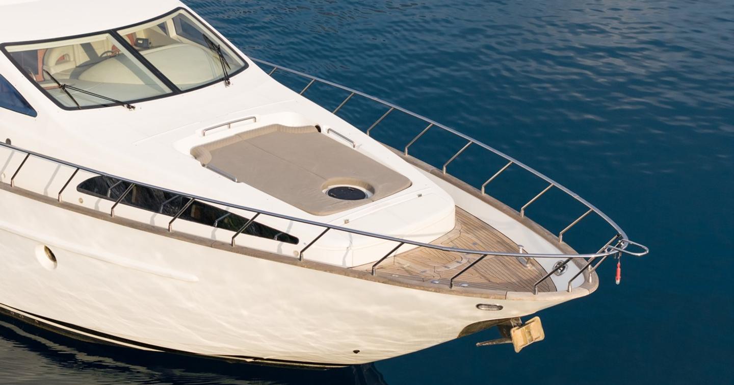 Motor yacht Senior S foredeck with grey sunpads 