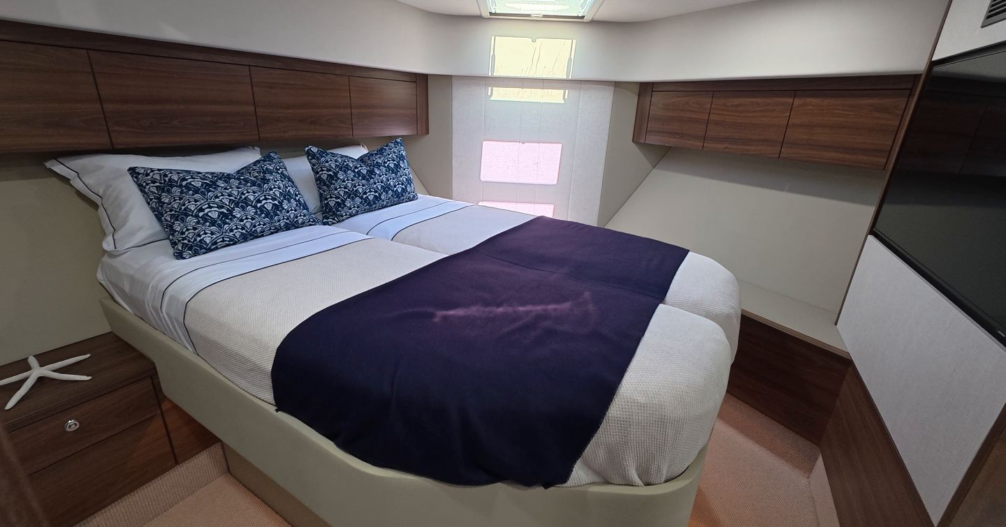 Maritimo M50 guest cabin with double berth, overhead storage and skylight hatch