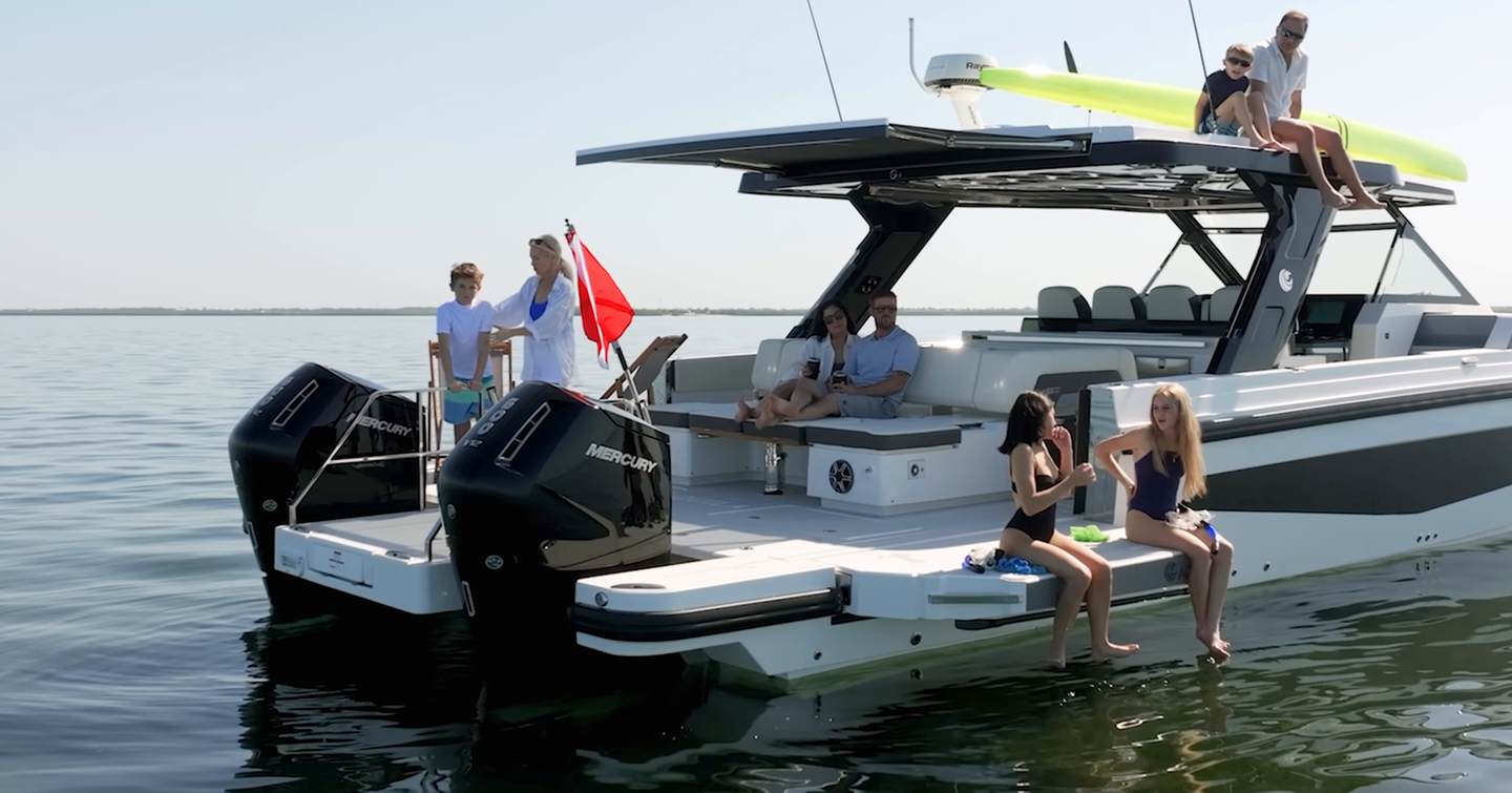 Aquila 45 Sport overhead view of aft deck and swim platform, showing twin outboards and central walkthrough layout