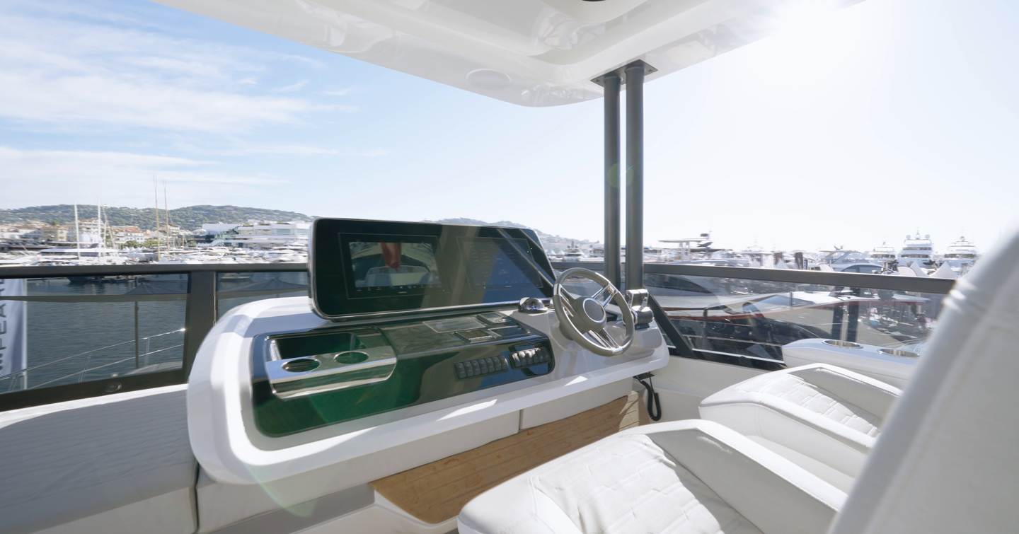 Pearl 73 flybridge helm with twin seats, wheel and display screen