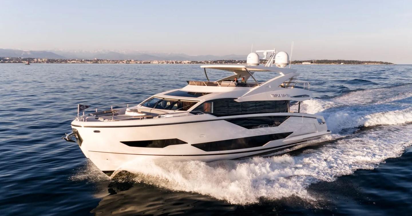 Motor Yacht Triple Eight underway at speed with sleek exterior profile
