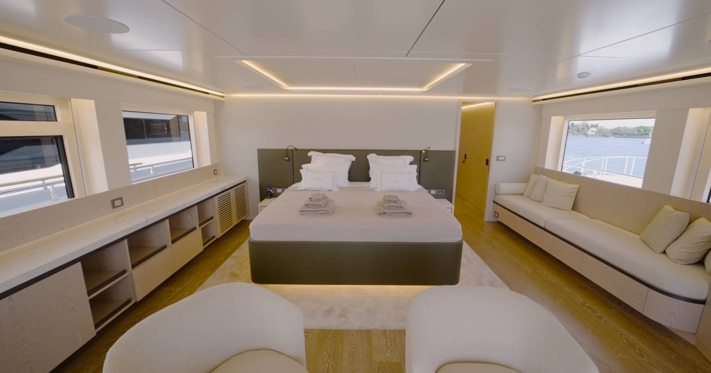Numarine 40MXP bridge deck owner's suite with panoramic windows, sofa and en suite access