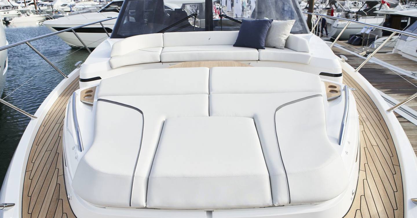 Princess V55 foredeck sunpad and forward seating area with teak side decks