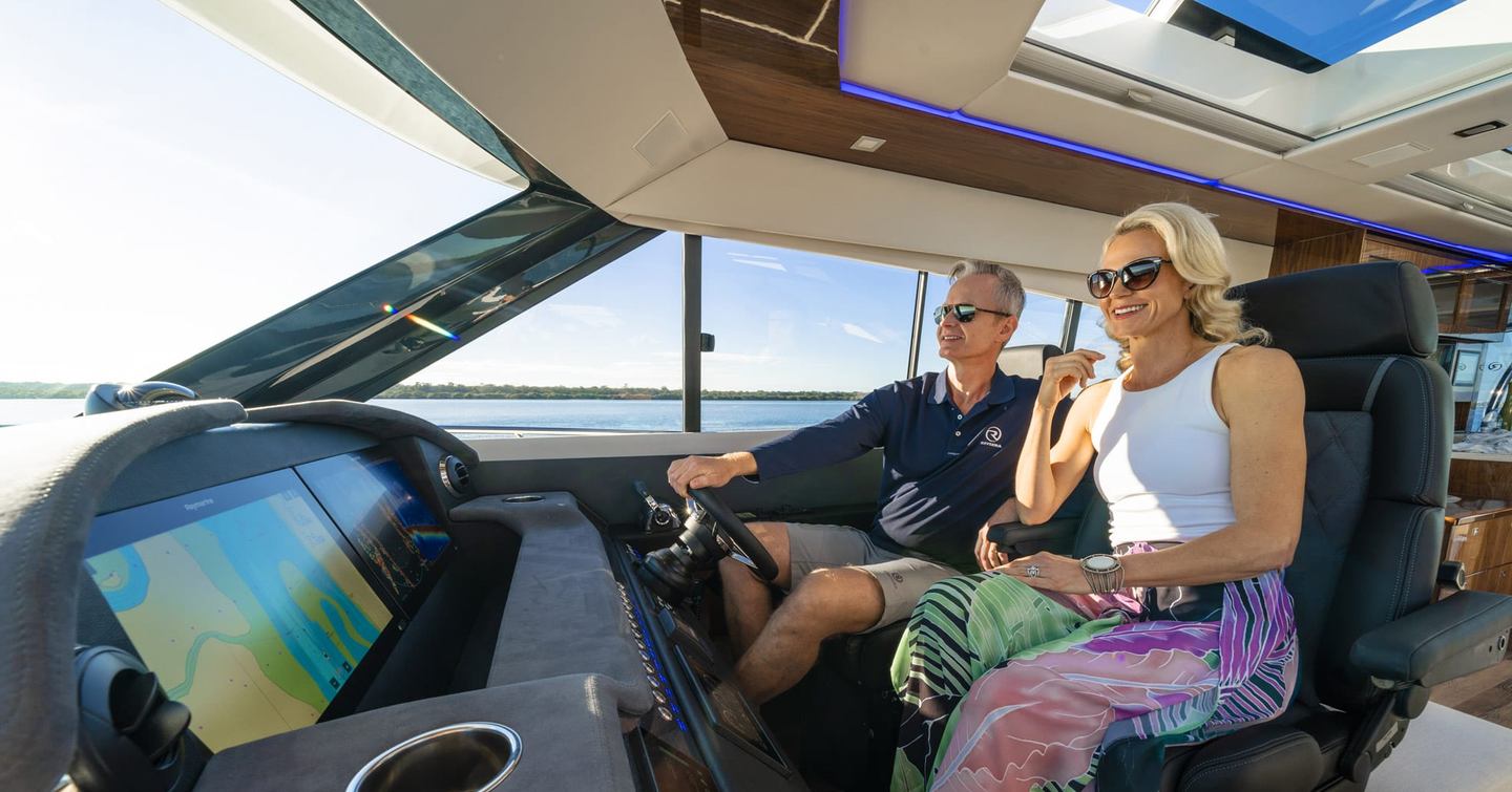 Riviera-6000-Sport-Yacht-Platinum-Edition-Review-helm-seating-area-underway-with-forward-visibility