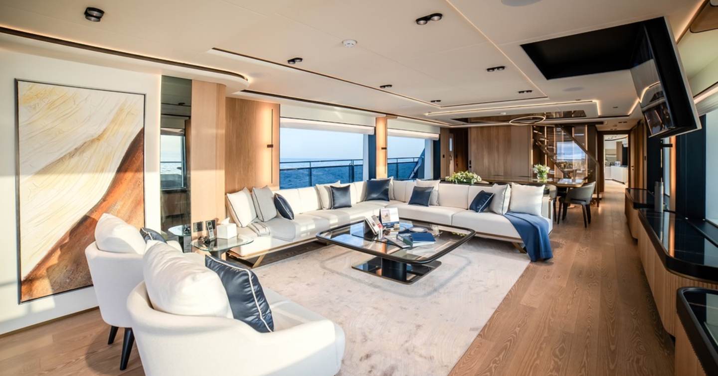 Majesty 112 Terrace Motor Yacht main saloon with L-shaped sofa