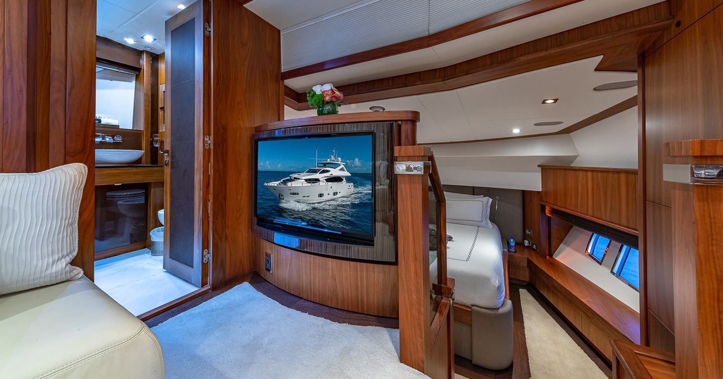 Superyacht Emrys master cabin private seating area with mounted TV