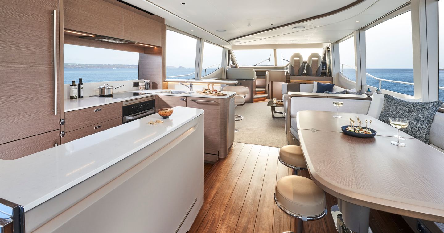 Princess Y72 motor yacht interior with grey furniture and helm station