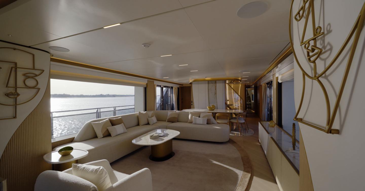 Main saloon aboard the Gulf Craft Majesty 100 Terrace with full-height glazing and open layout