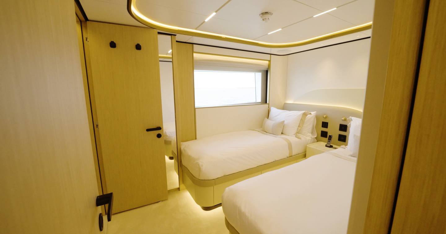 Twin guest cabin aboard the Gulf Craft Majesty 100 Terrace with convertible beds
