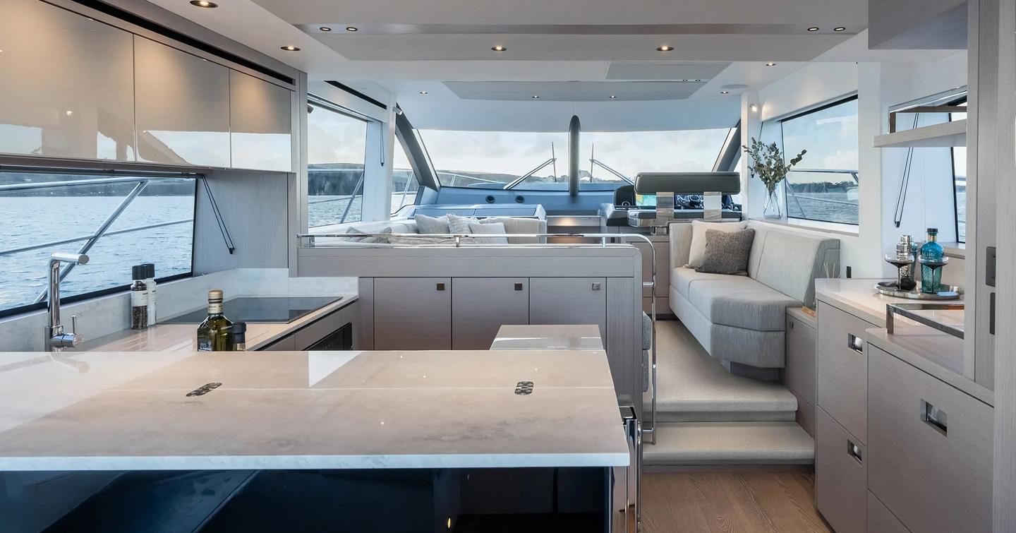 Sunseeker Manhattan 56 motor yacht saloon with U-shaped gally and neutral palette
